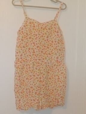 girl med bright flower print short romper